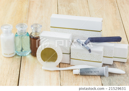 Tubes of bathroom amenity contains on wooden backg 21529631