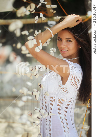 Woman with tropical decoration Woman with tropical decoration 21530347