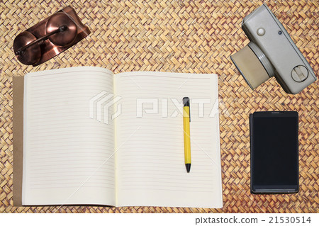 Book ,smart phone,  camera, clock on table 21530514