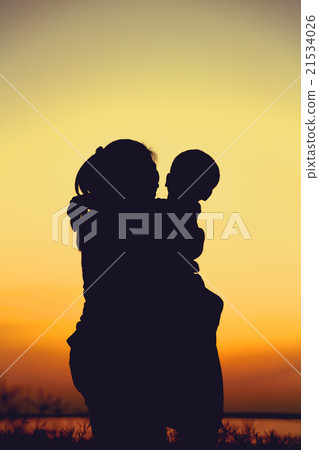 Silhouette of mother and child enjoying the view. Silhouette of mother and child enjoying the view. 21534026
