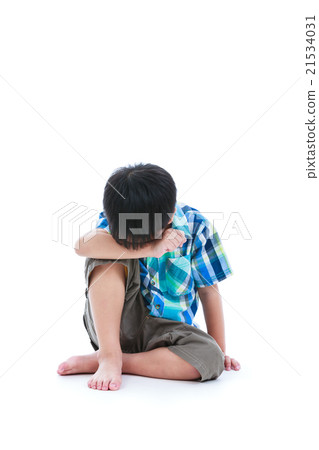 Little sad boy sitting on floor. Isolated on white Little sad boy sitting on floor. Isolated on white 21534031