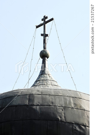 an Orthodox cross on the roof of the monastery 21537267