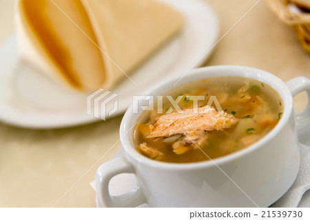Fish soup on  table at restaurant 21539730