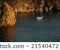 Boat near rocks at sunset on the lake Baikal 21540472