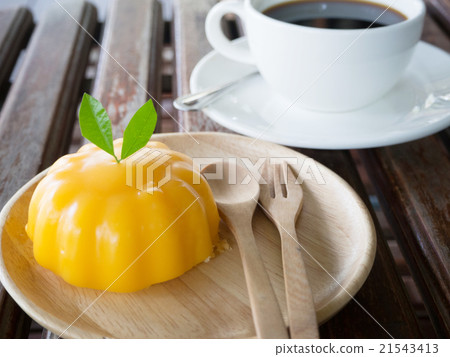 Cup of black coffee and orange cake 21543413