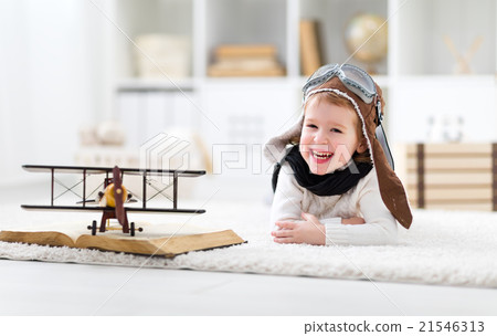 concept of dreams and travels.  Happy pilot aviator child with a 21546313