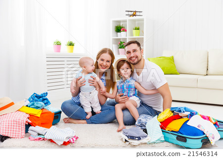 happy family mother, father and two children packed suitcases fo 21546314