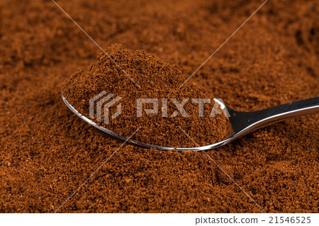 ground coffee and a metal spoon ground coffee and a metal spoon 21546525