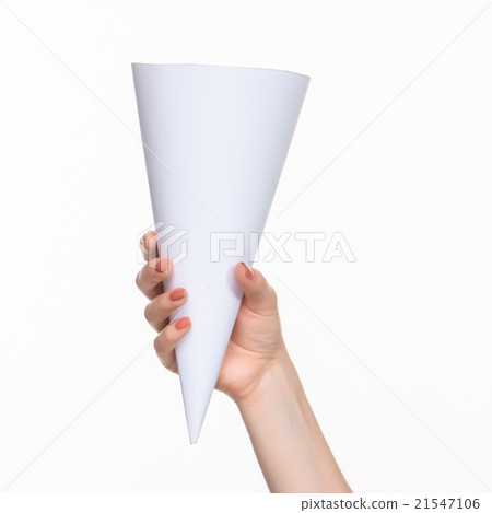 The cone in female hands on white background The cone in female hands on white background 21547106