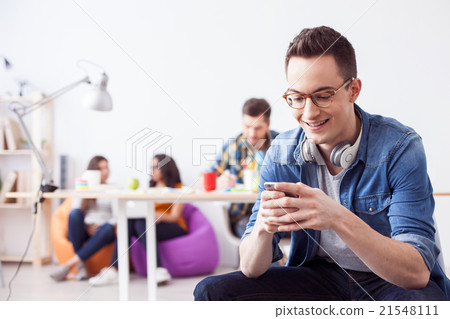 Cute guy is using telephone for fun 21548111