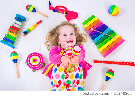 Little girl with music instruments 21548563