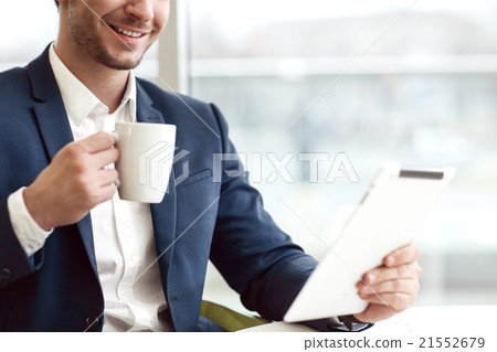 Cheerful man drinking coffee 21552679