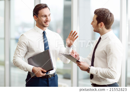 Pleasant business partners talking with each other 21552823
