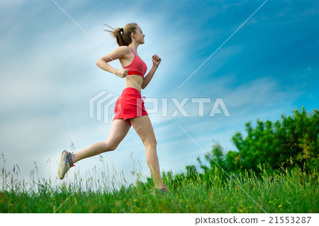 Young woman running summer park rural road Young woman running summer park rural road 21553287
