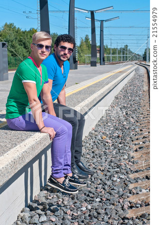 Two young men sitting on the platform Two young men sitting on the platform 21554979