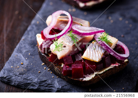 Sandwiches with herring and beetroot on a plate Sandwiches with herring and beetroot on a plate 21556968