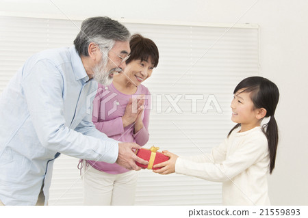 Grandparents and grandchild giving gifts gifts grandparents grandchild senior girls Grandparents and grandchild giving gifts gifts grandparents grandchild senior girls 21559893