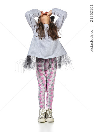 Little brunette girl in fashionable dress posing Little brunette girl in fashionable dress posing 21562191