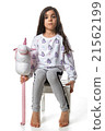 Brunette little girl posing on chair izolated 21562199