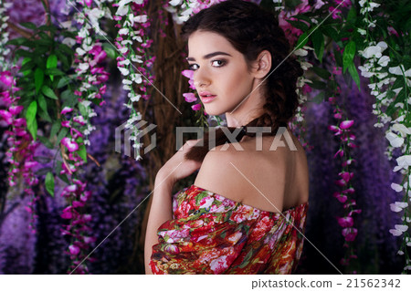 Pretty girl in magic wistaria garden Pretty girl in magic wistaria garden 21562342