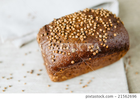 Black bread with fresh coriander closeup 21562696
