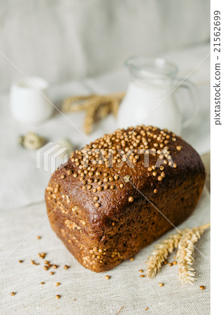Sliced bread with fresh coriander and milk 21562699