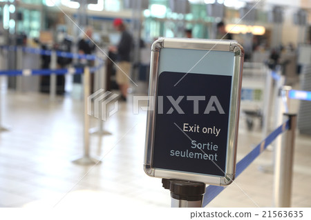 Close up exit sign inside YVR airport 21563635