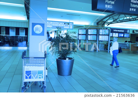 One side of people walking inside YVR airport One side of people walking inside YVR airport 21563636