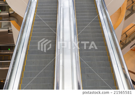 Escalator in a mall Escalator in a mall 21565581