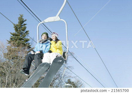 20's couple riding a lift 21565700