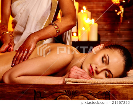 Woman having Ayurvedic spa treatment. 21567233