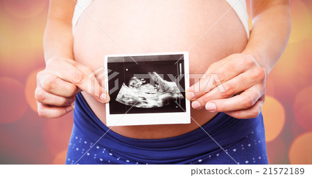 Composite image of pregnant woman showing ultrasound scans 21572189