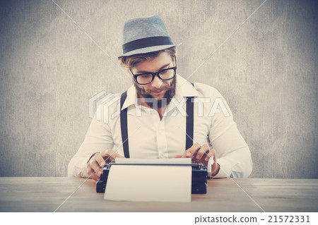 Composite image of hipster wearing eye glasses and hat working on typewriter 21572331