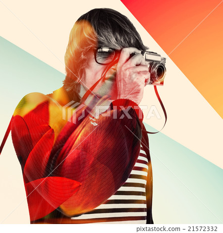 Composite image of hipster taking pictures with an old camera  21572332