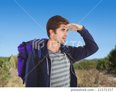Composite image of man with backpack shielding eyes Composite image of man with backpack shielding eyes 21572357