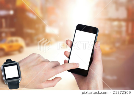 Composite image of woman using smartwatch and phone Composite image of woman using smartwatch and phone 21572509