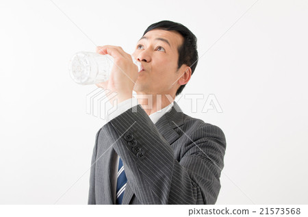 Businessman drinking water of plastic bottle 21573568