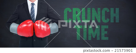 Composite image of businessman with boxing gloves 21573901