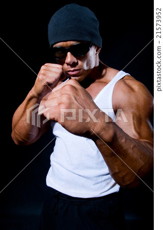 The strong sports person in a boxing rack 21573952