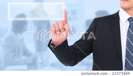 Composite image of unsmiling businessman pointing his finger 21573984