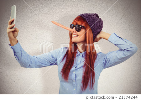Composite image of smiling hipster woman taking selfie Composite image of smiling hipster woman taking selfie 21574244