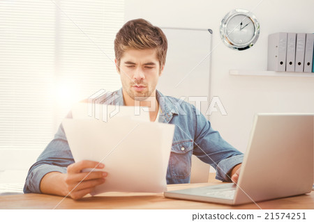 Composite image of hipster looking at documents while sitting at Composite image of hipster looking at documents while sitting at 21574251