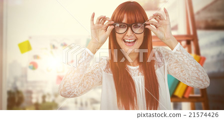 Composite image of smiling hipster woman posing face to the came Composite image of smiling hipster woman posing face to the came 21574426