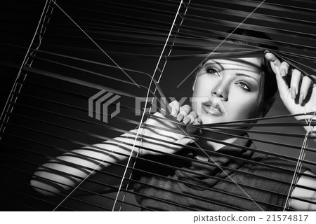 sexy woman in black dress and jalousie 21574817