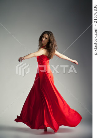 Ballet dancer wearing red dress over grey 21576836