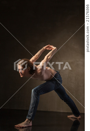 Young and stylish modern dancer on grey background 21576866