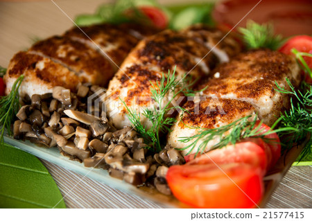 Breading chicken cutlets on a plate  21577415
