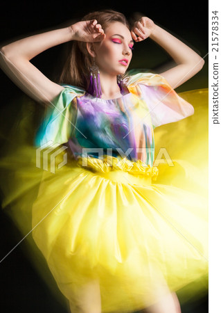 beautiful woman in long yellow dress 21578334