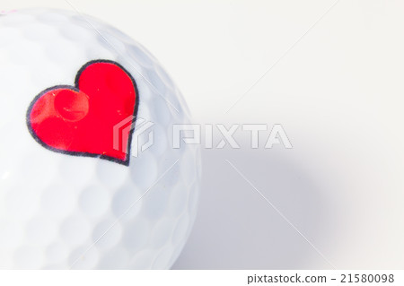 White golf ball with red heart. 21580098