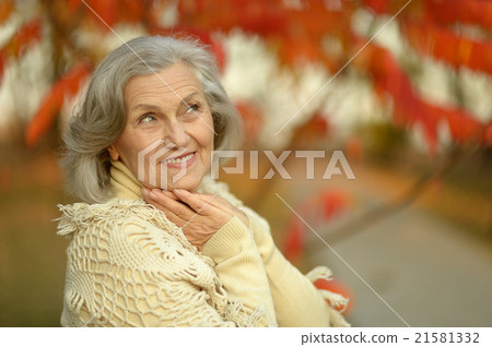 senior woman in autumn park senior woman in autumn park 21581332